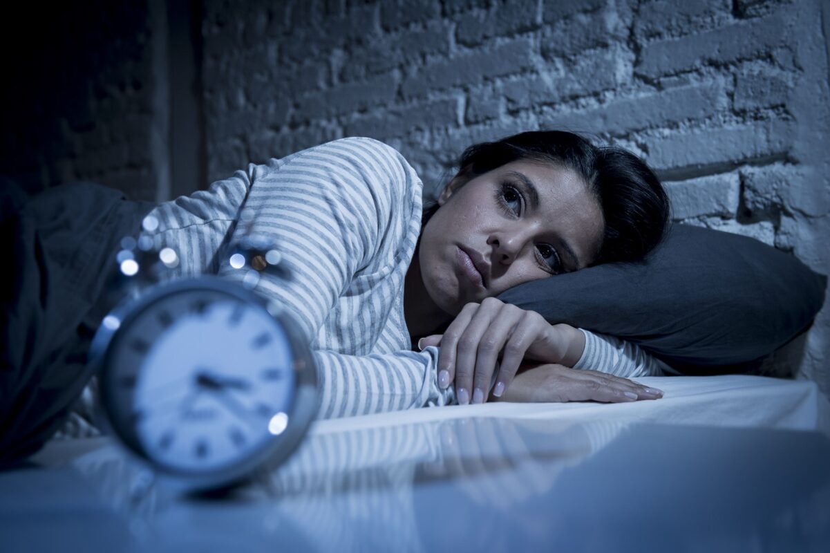 Image of a woman unable to sleep.